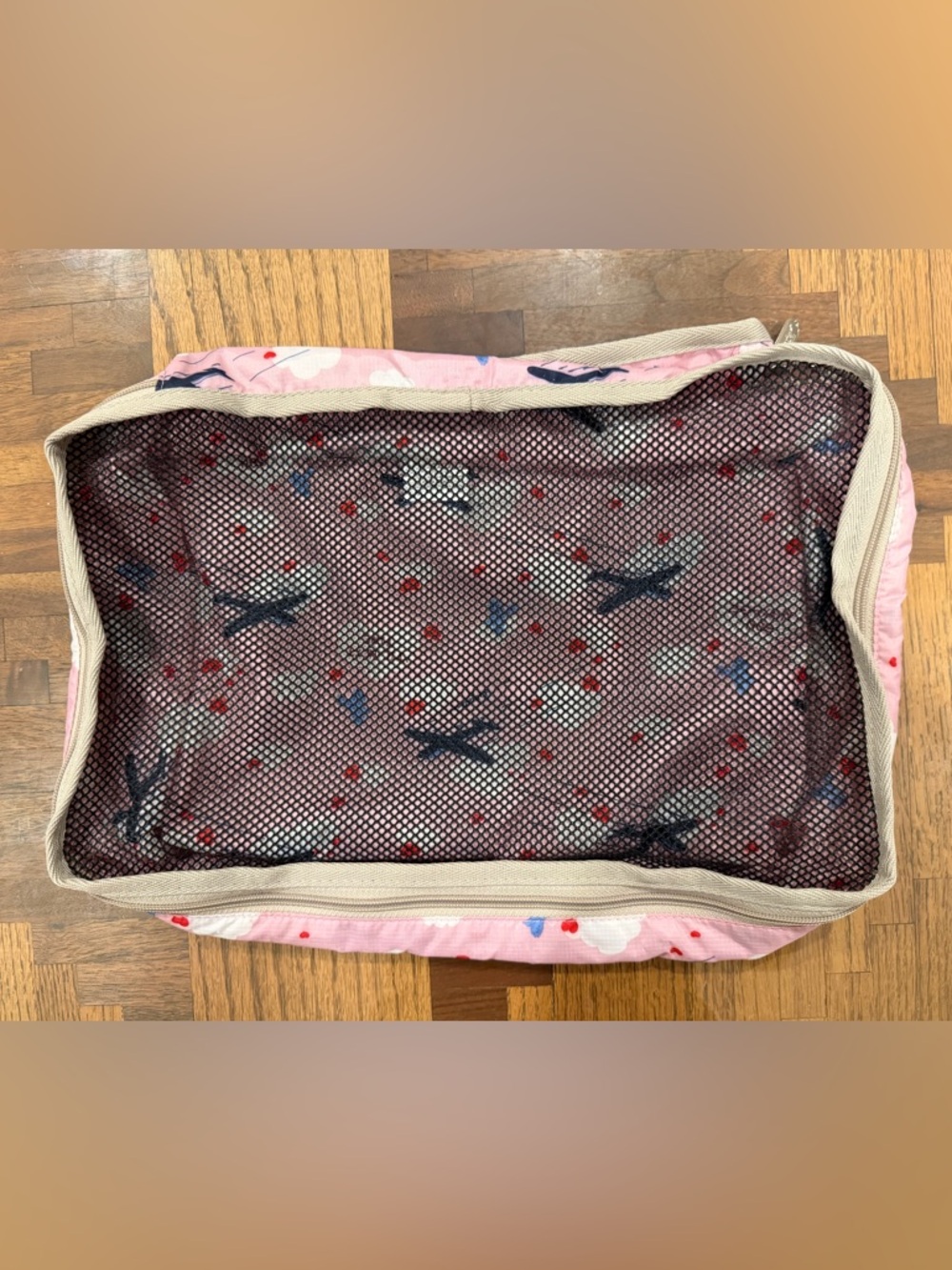 LeSportsac Pink and Tan medium packing cube with Airplane Print